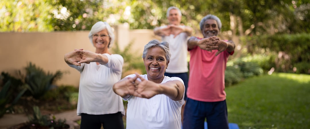 A group of elderly residents stretching